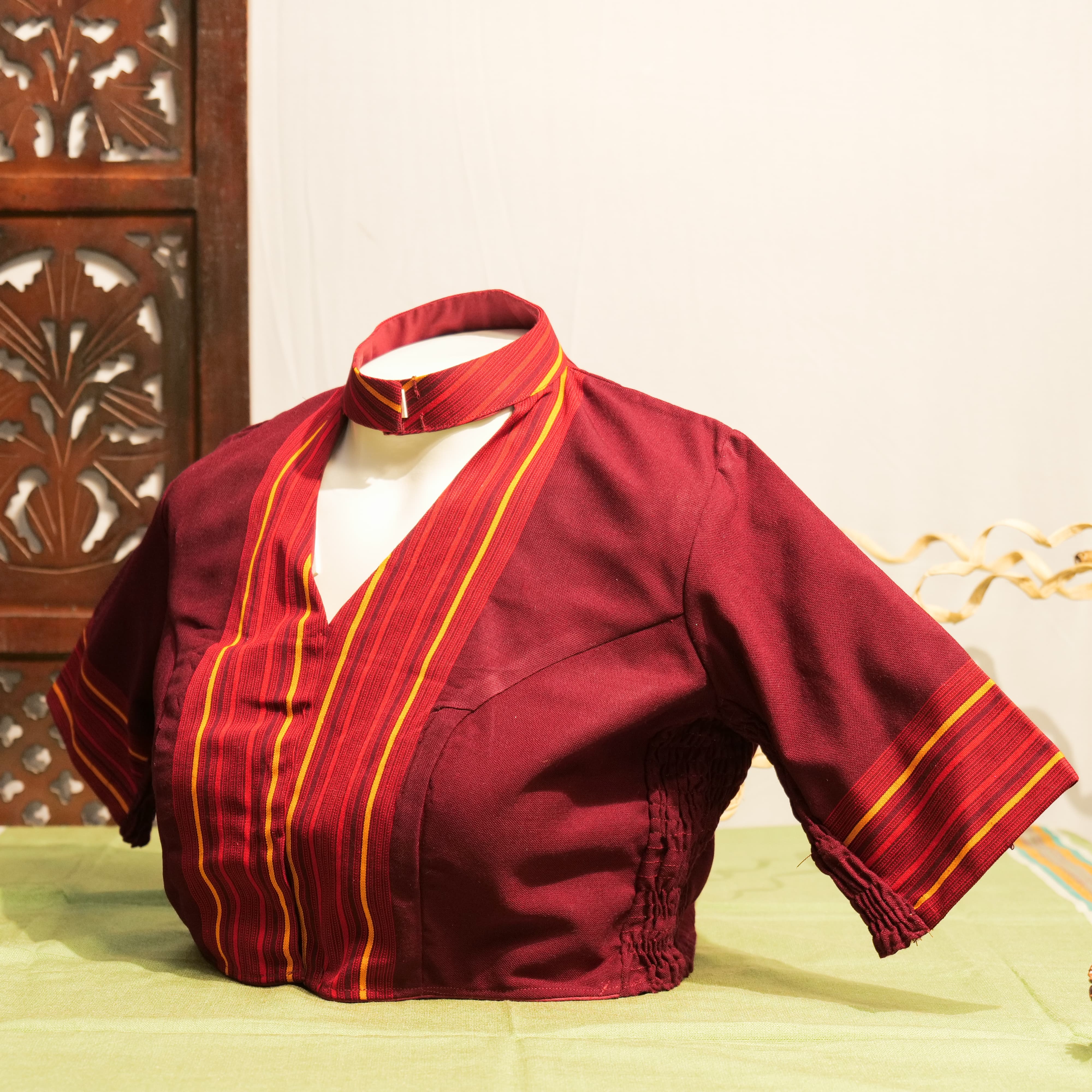 HIGH NECK STRETCHLINE BLOUSE WITH TIWA MOTIF